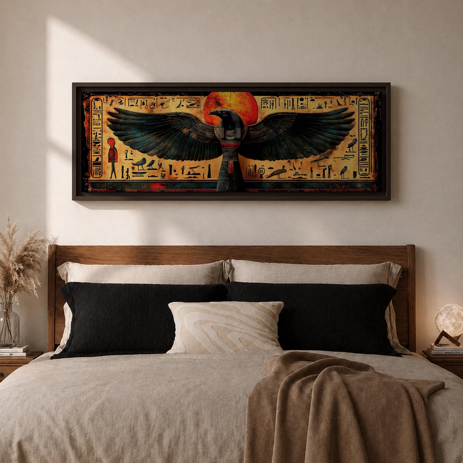Panoramic ancient Egyptian style artwork featuring the falcon headed god Horus with wide outstretched wings beneath a glowing red sun disk. Hieroglyphic symbols and figures frame the composition while textured gold and dark tones highlight the wings and central deity across the wide symmetrical scene.