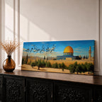 A long narrow panoramic painting depicts Masjid Al Aqsa with its iconic golden dome rising above stone walls and surrounding trees, set against a clear sky with Arabic calligraphy flowing across the upper composition, rendered in a detailed painterly style that blends architectural precision with warm tones and a serene landscape atmosphere.