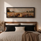 Panoramic wildflower meadow landscape painting featuring a soft rural field filled with scattered blue and white flowers across golden grasses. A narrow path leads through the meadow toward distant trees and open countryside beneath a muted cloudy sky, with textured brushstrokes creating depth across the wide pastoral scene.