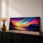 Panoramic northern lights landscape painting showing vibrant aurora borealis ribbons sweeping across a night sky in bright greens pinks and purples. Dark mountain silhouettes frame a reflective lake while glowing colors spread across the horizon creating a dramatic wide arctic night scene.