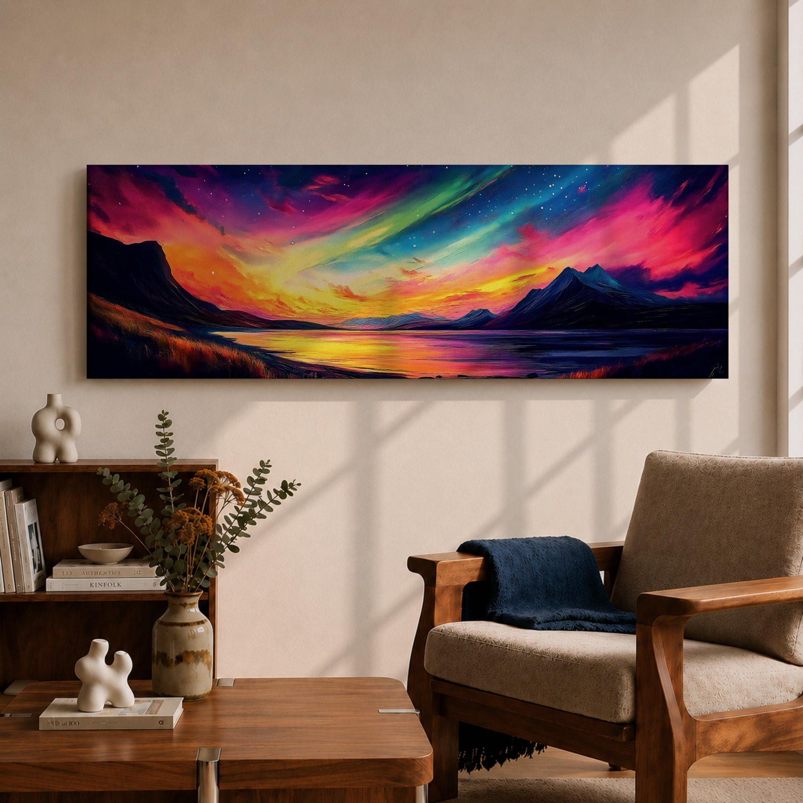 Panoramic northern lights landscape painting showing vibrant aurora borealis ribbons sweeping across a night sky in bright greens pinks and purples. Dark mountain silhouettes frame a reflective lake while glowing colors spread across the horizon creating a dramatic wide arctic night scene.