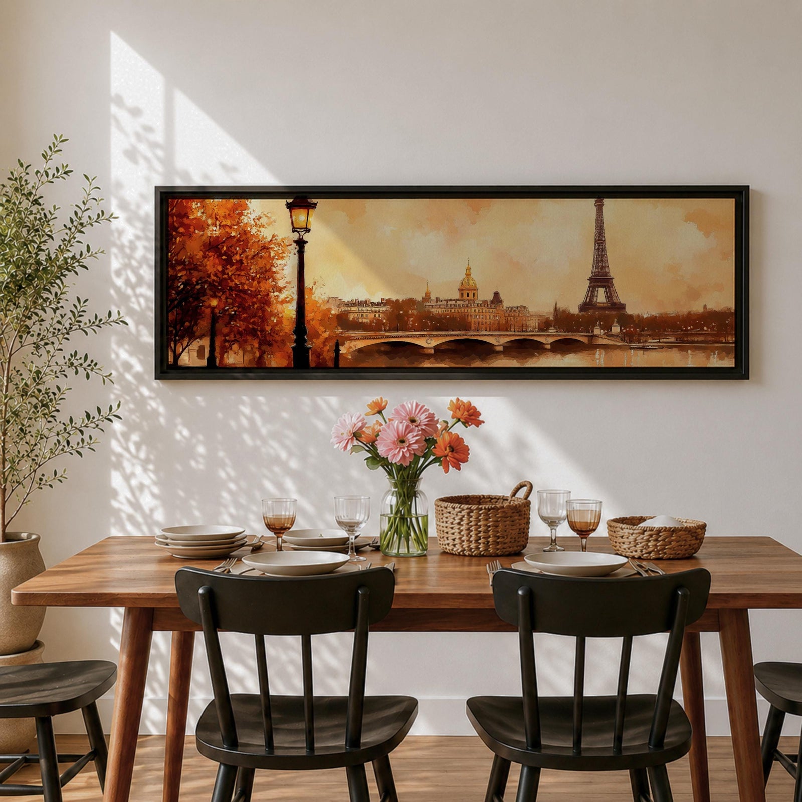 A long panoramic watercolor style painting of the Eiffel Tower rising above the Paris skyline beside the Seine River. Warm autumn foliage frames the scene while a bridge crosses the river and historic buildings sit beneath a glowing sky, creating a romantic Paris cityscape in a wide horizontal composition.