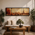 A long panoramic watercolor style painting of the Eiffel Tower rising above the Paris skyline beside the Seine River. Warm autumn foliage frames the scene while a bridge crosses the river and historic buildings sit beneath a glowing sky, creating a romantic Paris cityscape in a wide horizontal composition.