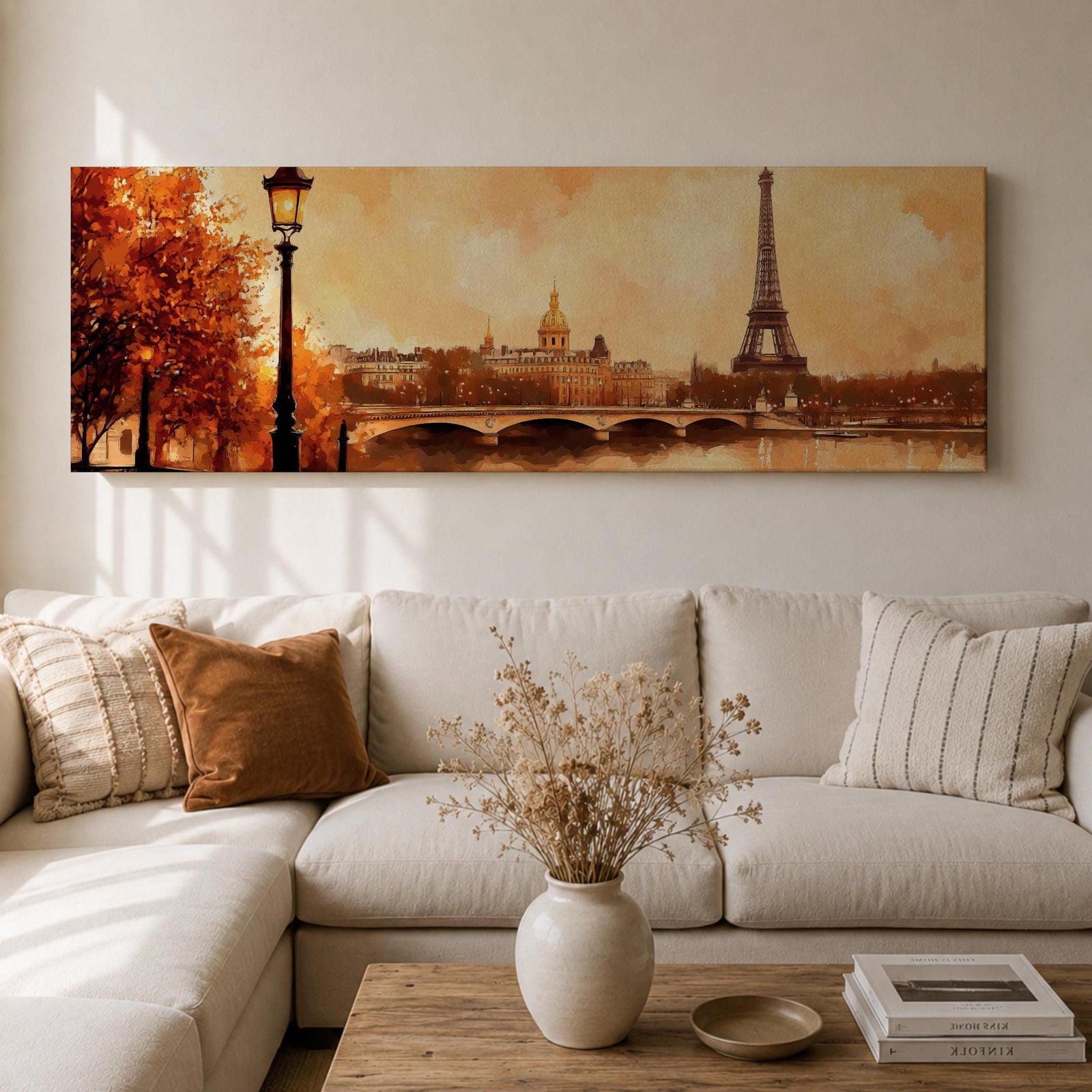 A long panoramic watercolor style painting of the Eiffel Tower rising above the Paris skyline beside the Seine River. Warm autumn foliage frames the scene while a bridge crosses the river and historic buildings sit beneath a glowing sky, creating a romantic Paris cityscape in a wide horizontal composition.