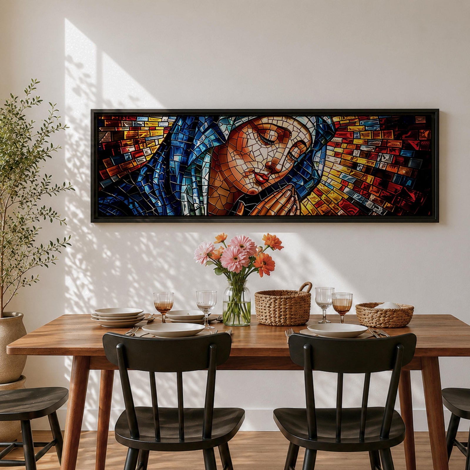Panoramic stained glass style artwork of the Virgin Mary with closed eyes and folded hands in prayer. Colorful mosaic tiles form her blue veil and warm skin tones while radiant red gold and blue glass pieces spread outward like a halo creating a luminous sacred composition.