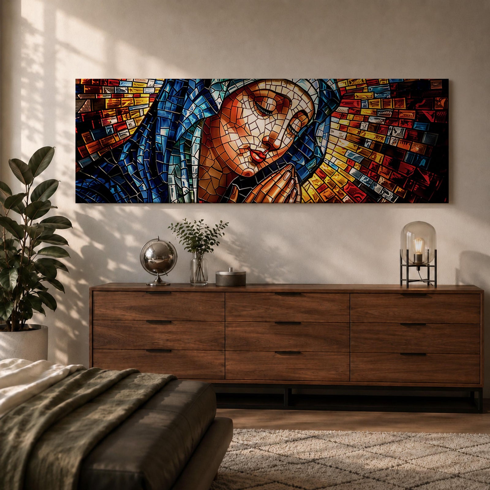 Panoramic stained glass style artwork of the Virgin Mary with closed eyes and folded hands in prayer. Colorful mosaic tiles form her blue veil and warm skin tones while radiant red gold and blue glass pieces spread outward like a halo creating a luminous sacred composition.