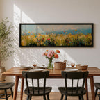 Panoramic wildflower meadow painting featuring tall golden grasses mixed with scattered red, yellow, and blue flowers swaying across an open field. Loose textured brushstrokes create depth through the meadow while a soft blue sky and distant horizon stretch across the wide landscape composition.