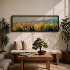 Panoramic wildflower meadow painting featuring tall golden grasses mixed with scattered red, yellow, and blue flowers swaying across an open field. Loose textured brushstrokes create depth through the meadow while a soft blue sky and distant horizon stretch across the wide landscape composition.