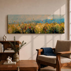 Panoramic wildflower meadow painting featuring tall golden grasses mixed with scattered red, yellow, and blue flowers swaying across an open field. Loose textured brushstrokes create depth through the meadow while a soft blue sky and distant horizon stretch across the wide landscape composition.
