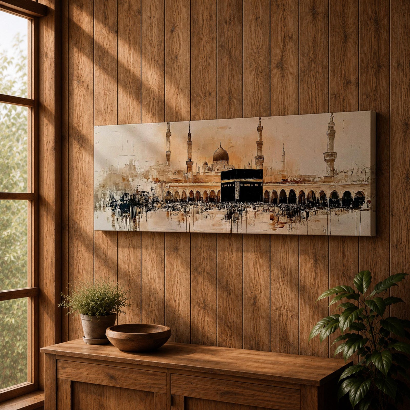 Panoramic painting of the Kaaba at Masjid Al Haram in Mecca surrounded by mosque arches and tall minarets. The sacred black cube stands at the center of a wide courtyard with crowds gathered around while warm golden tones and architectural details stretch across the expansive skyline.