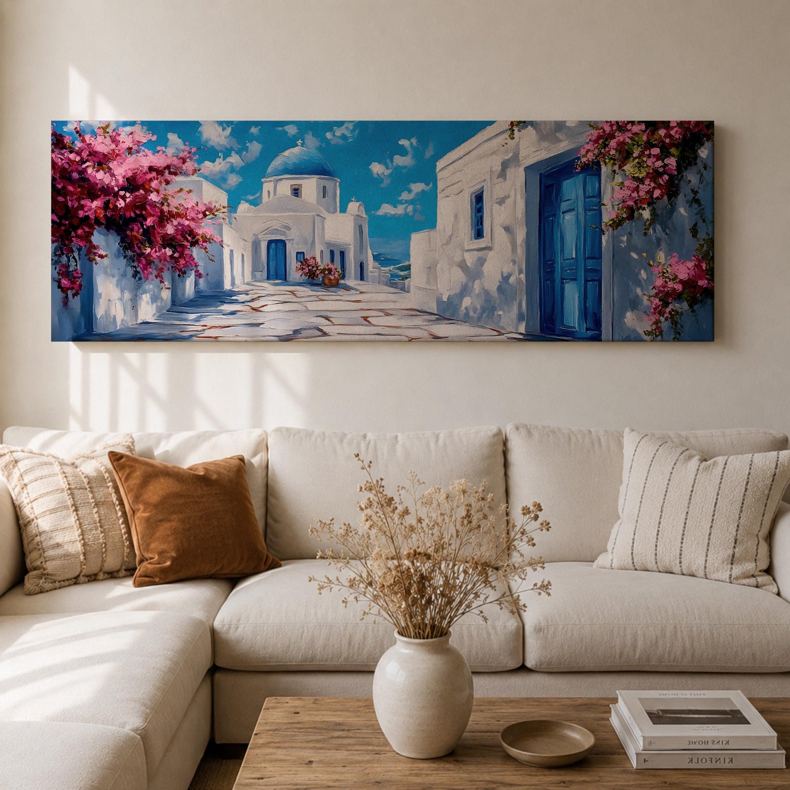 Panoramic painting of a Santorini village featuring whitewashed buildings with blue doors and a domed church along a sunlit stone pathway. Pink bougainvillea flowers frame the scene while bright blue sky and distant Aegean Sea appear beyond the island architecture across the wide composition.