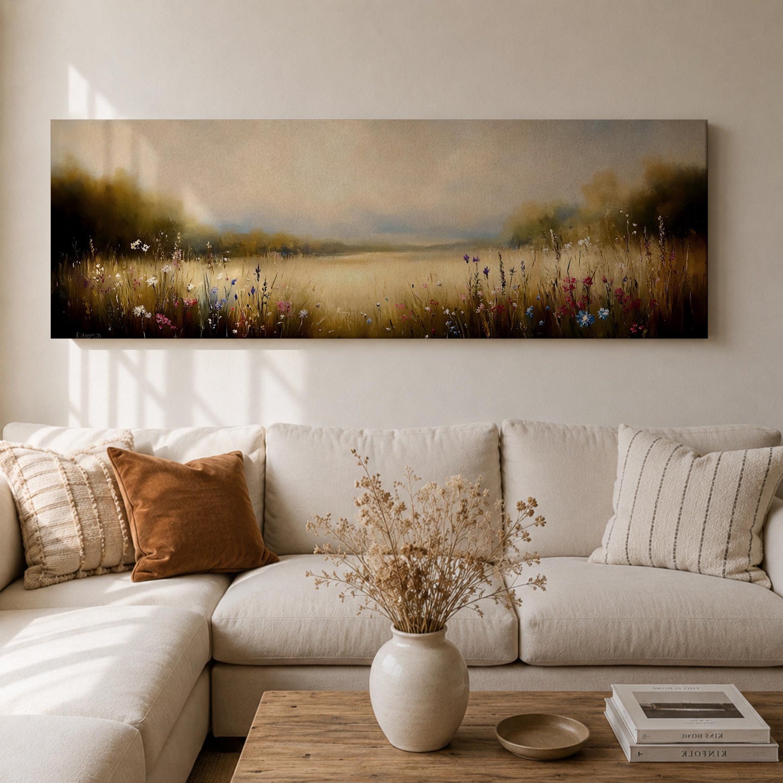 Panoramic meadow landscape painting showing soft golden grasses and delicate wildflowers across an open countryside field with distant trees and a glowing sky creating a peaceful prairie scene.