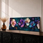 Panoramic teal floral wall art featuring large decorative botanical flowers in purple pink and ivory tones on a deep teal background creating an elegant modern floral composition.
