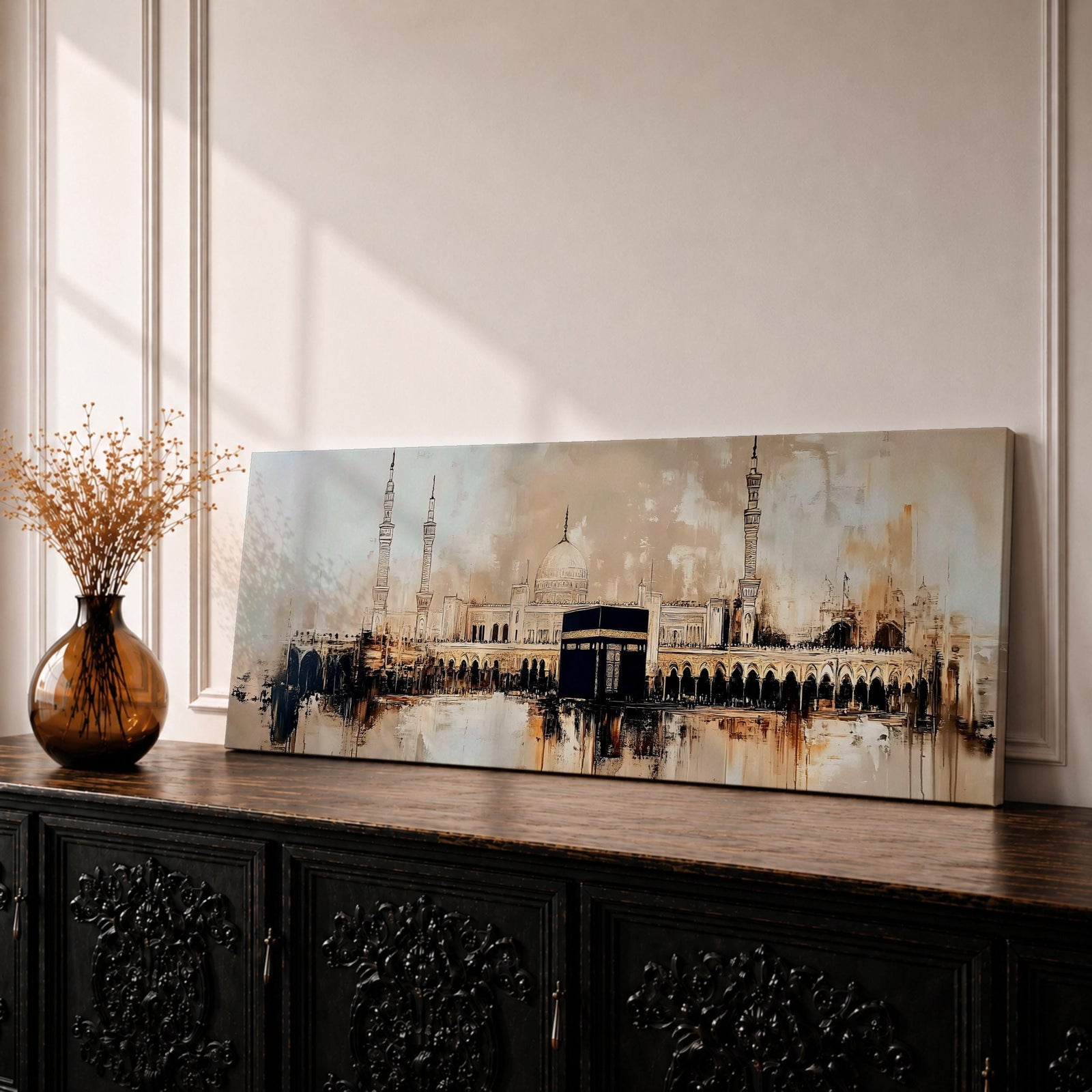 Panoramic painting of the Kaaba at Masjid al Haram with surrounding mosque arches and minarets, rendered in a loose abstract style with warm beige, brown, and black tones. The composition stretches horizontally with expressive brush textures, architectural silhouettes, and layered strokes highlighting the Kaaba at the center of the sacred mosque complex.
