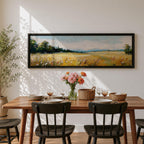 Panoramic countryside landscape painting showing a wide golden field filled with tall grasses and scattered wildflowers. A tree line borders the meadow while distant hills stretch across the horizon beneath a soft blue sky with light clouds across the expansive rural scene.