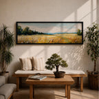 Panoramic countryside landscape painting showing a wide golden field filled with tall grasses and scattered wildflowers. A tree line borders the meadow while distant hills stretch across the horizon beneath a soft blue sky with light clouds across the expansive rural scene.