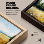 Panoramic countryside landscape painting showing a wide golden field filled with tall grasses and scattered wildflowers. A tree line borders the meadow while distant hills stretch across the horizon beneath a soft blue sky with light clouds across the expansive rural scene.
