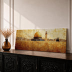 Panoramic painting of the Dome of the Rock rising above the stone walls of Jerusalem with the golden dome and nearby minaret dominating the skyline. The horizontal composition features textured brushwork in warm gold and earth tones, depicting the historic mosque complex, city structures, and layered stone architecture across the Jerusalem landscape.