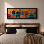 Panoramic illustration of colorful mosque domes and minarets arranged in a horizontal skyline. The composition features Moroccan inspired architectural forms with geometric patterns, tile motifs, and layered dome shapes in vibrant shades of turquoise, blue, orange, red, and gold across a stylized Islamic architectural landscape.