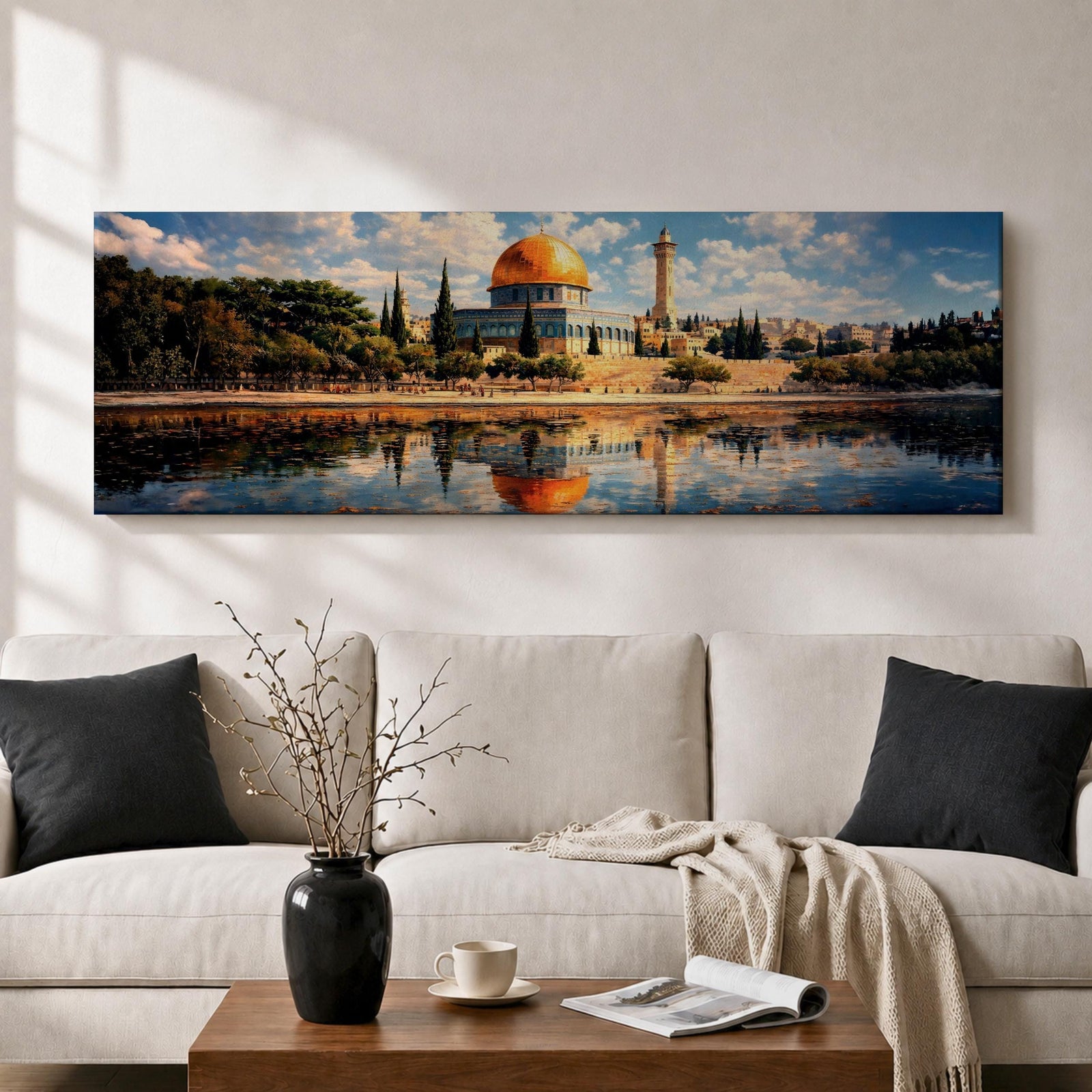 Panoramic canvas artwork depicting the Dome of the Rock in Jerusalem with its iconic golden dome and blue tiled octagonal structure rising above surrounding trees and historic buildings, reflected in calm water in the foreground beneath a bright sky filled with scattered clouds, rendered in a detailed landscape style emphasizing the architecture and skyline of the sacred site.