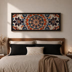 Panoramic artwork displaying an intricate Islamic mandala composed of symmetrical Moorish geometric and floral motifs radiating from a central rosette, featuring layered arabesque shapes and zellige inspired tile patterns in orange, blue, cream, and dark accents arranged in a balanced ornamental composition.