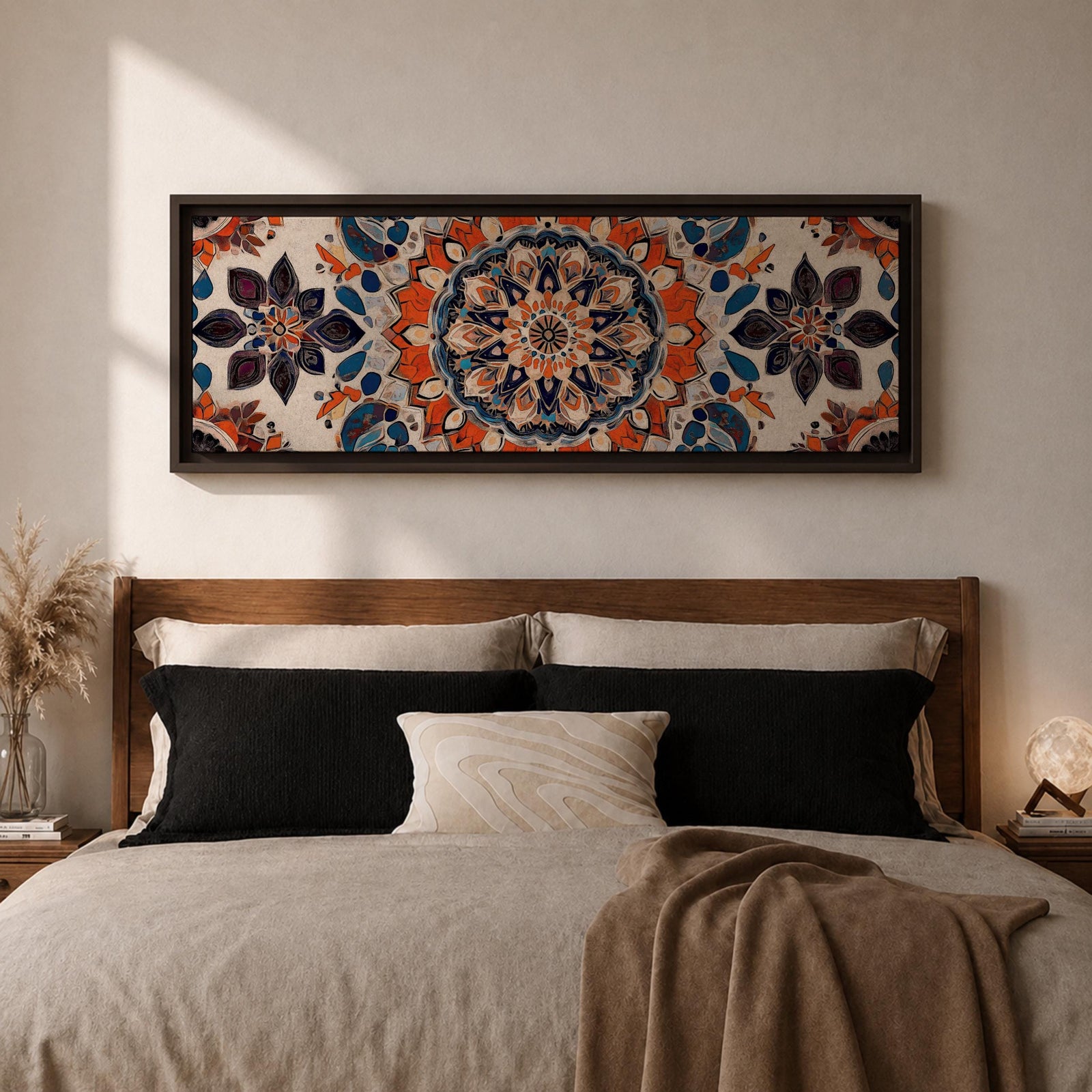 Panoramic artwork displaying an intricate Islamic mandala composed of symmetrical Moorish geometric and floral motifs radiating from a central rosette, featuring layered arabesque shapes and zellige inspired tile patterns in orange, blue, cream, and dark accents arranged in a balanced ornamental composition.