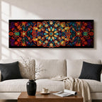 Panoramic artwork featuring a vibrant Islamic mandala composed of intricate arabesque and geometric patterns radiating from a central rosette, with layered symmetrical motifs in rich shades of red, orange, teal, blue, and gold set against a dark background, inspired by traditional Moroccan and Islamic ornamental design.