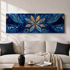 Panoramic floral mandala artwork featuring a symmetrical lotus flower design with layered petals spreading outward in deep blue and gold tones, accented with delicate botanical shapes and watercolor textures that create an intricate ornamental pattern across a wide horizontal composition.