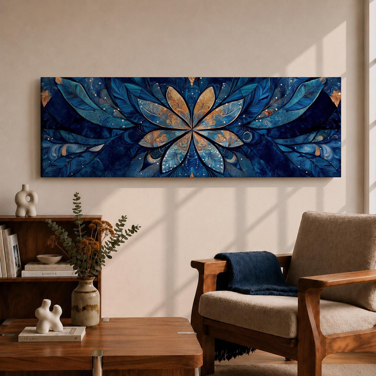 Panoramic floral mandala artwork featuring a symmetrical lotus flower design with layered petals spreading outward in deep blue and gold tones, accented with delicate botanical shapes and watercolor textures that create an intricate ornamental pattern across a wide horizontal composition.