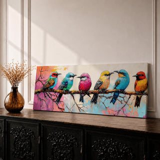 Panoramic painting of colorful tropical birds perched along a tree branch, featuring multiple small songbirds in vibrant shades of blue, pink, yellow, orange, and teal against a soft pastel background with delicate branches and expressive brushstrokes forming a lively horizontal nature composition.