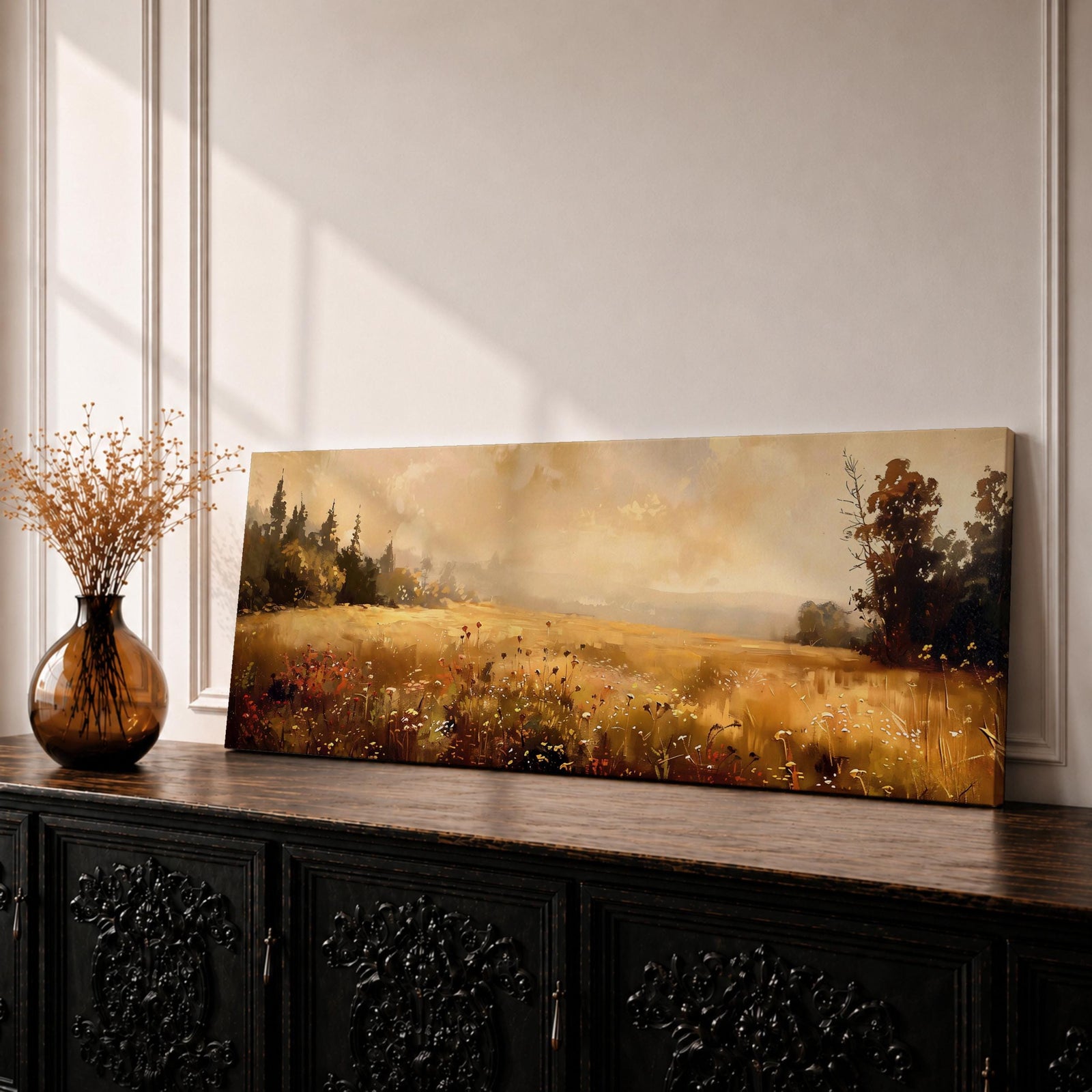 Panoramic landscape painting of a golden meadow filled with delicate wildflowers and tall grasses illuminated by warm sunlight, with distant trees along the horizon and soft glowing skies above, rendered in earthy tones and loose brushstrokes forming a peaceful rustic countryside scene.