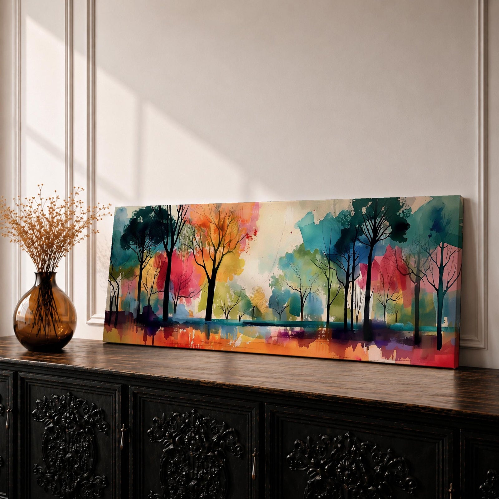 Panoramic abstract watercolor painting of a forest landscape with tall slender tree silhouettes reflected in still water, surrounded by vibrant washes of teal, orange, red, yellow, and green forming a colorful woodland scene with expressive brushwork and soft atmospheric blending.
