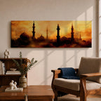 Panoramic artwork depicting a dramatic skyline of mosque domes and tall minarets silhouetted against a glowing golden sunset sky, with warm amber and orange tones diffused through atmospheric haze creating a striking Islamic architectural horizon.