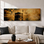 Panoramic artwork depicting the Kaaba in Mecca surrounded by the Masjid al-Haram courtyard with tall minarets rising through golden atmospheric light and dramatic clouds, creating a sacred Islamic architectural scene.