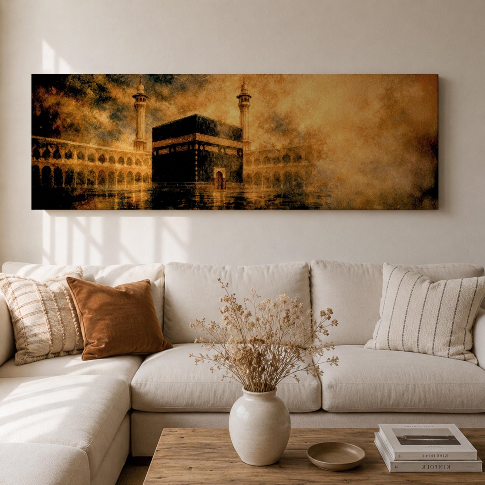 Panoramic artwork depicting the Kaaba in Mecca surrounded by the Masjid al-Haram courtyard with tall minarets rising through golden atmospheric light and dramatic clouds, creating a sacred Islamic architectural scene.