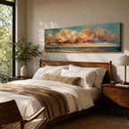 Panoramic coastal painting featuring dramatic sunset clouds above the ocean horizon with waves along a sandy beach, rendered in warm pastel sky tones and textured brushstrokes creating a peaceful seaside landscape.