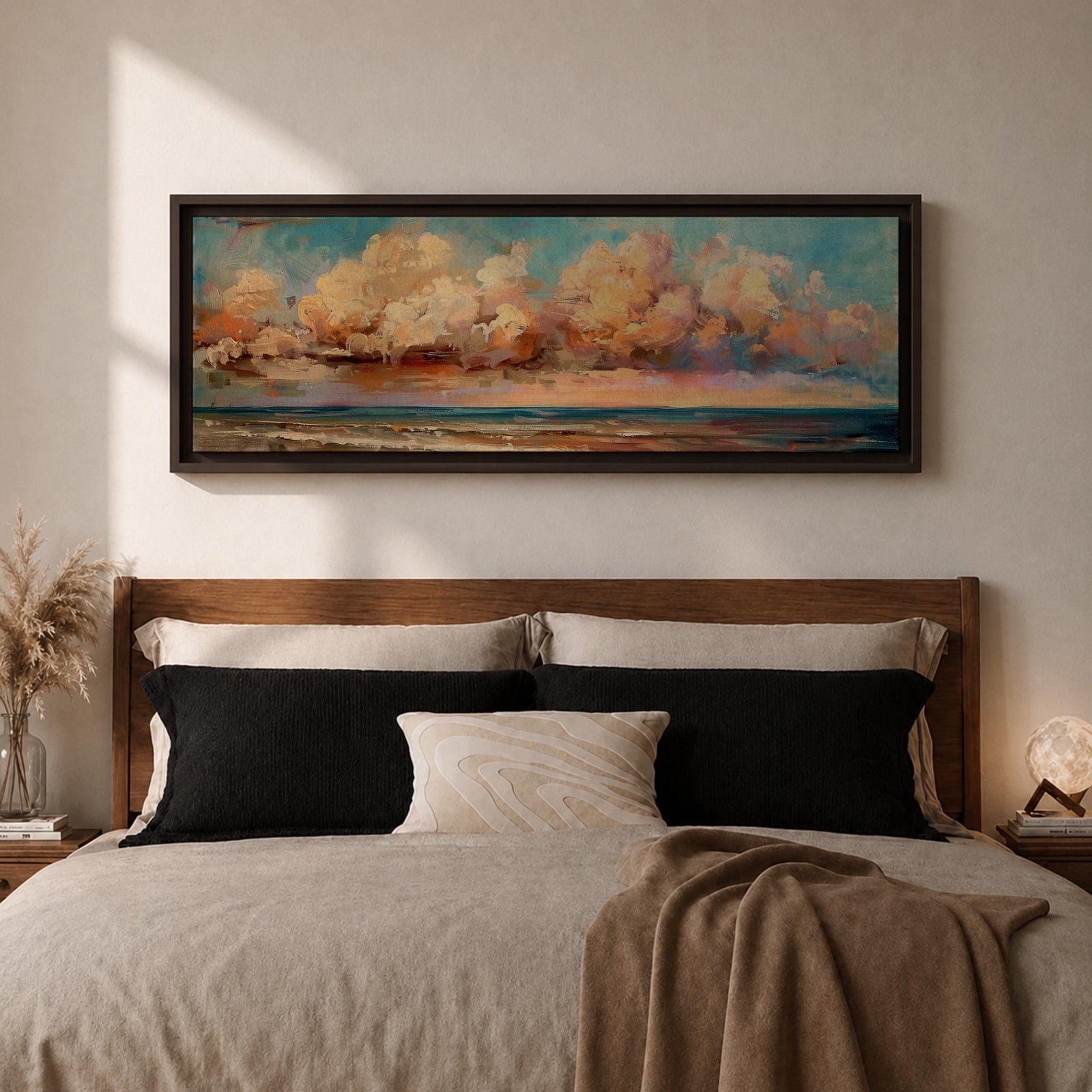 Panoramic coastal painting featuring dramatic sunset clouds above the ocean horizon with waves along a sandy beach, rendered in warm pastel sky tones and textured brushstrokes creating a peaceful seaside landscape.