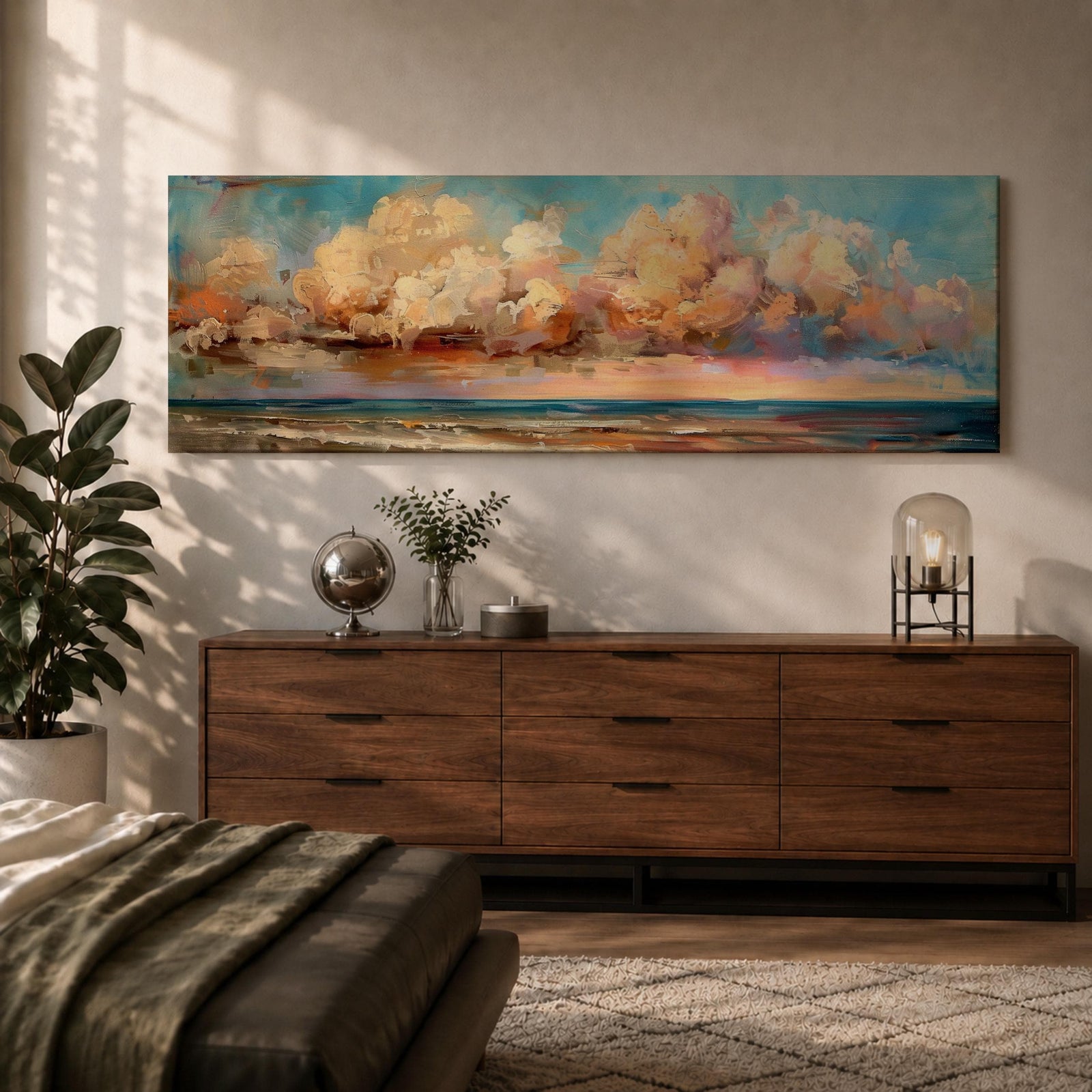 Panoramic coastal painting featuring dramatic sunset clouds above the ocean horizon with waves along a sandy beach, rendered in warm pastel sky tones and textured brushstrokes creating a peaceful seaside landscape.