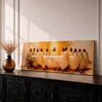 Panoramic religious painting depicting Jesus and the twelve disciples gathered around the Last Supper table illuminated by warm golden light, creating a sacred Christian biblical scene.