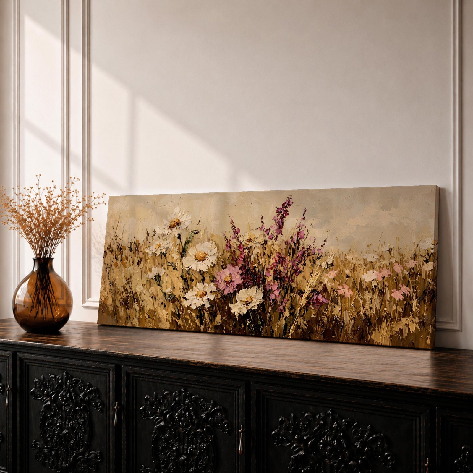 A long panoramic painting of a wildflower meadow filled with white daisies and pink blossoms rising from golden grasses, rendered with thick textured brushstrokes in a painterly style, where warm earthy tones blend with soft creams and blush pinks to create a natural field scene stretching across the horizontal composition.