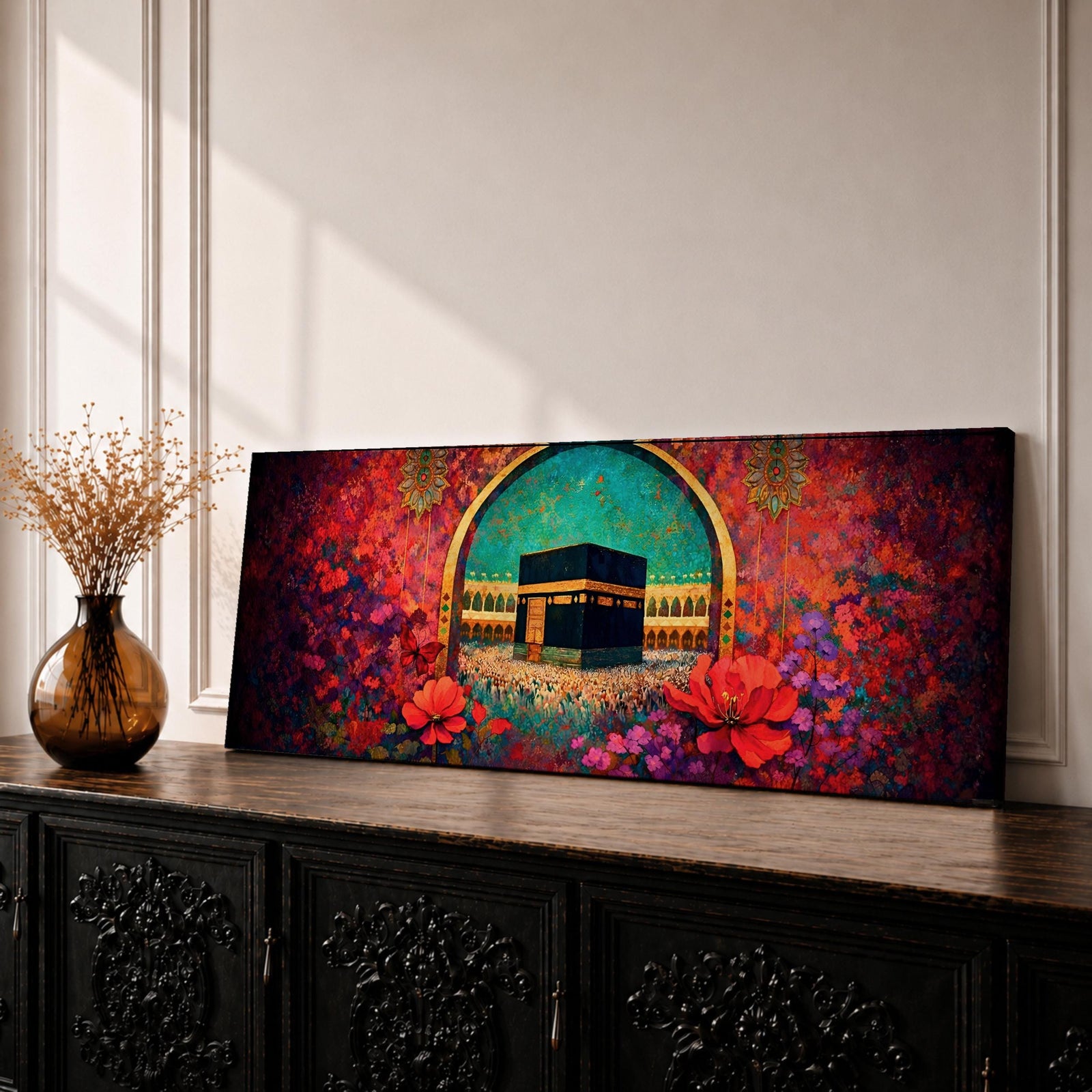 A vibrant panoramic painting of the Kaaba at the center of Masjid Al Haram in Mecca framed by a decorative Islamic arch and surrounded by rich fields of red and pink flowers, with intricate ornamental patterns and crowds of worshippers gathered around the sacred structure beneath a bright turquoise sky.