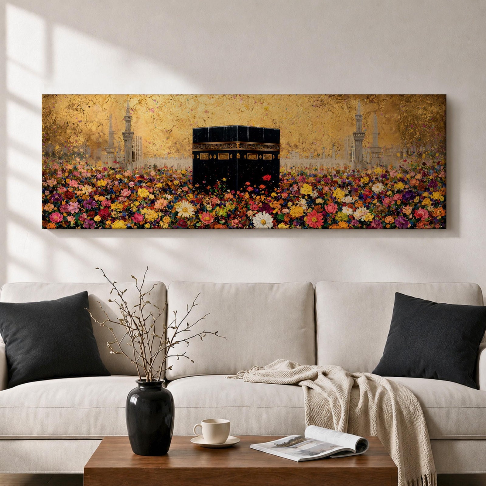 A panoramic painting of the Kaaba standing at the center of a vibrant field of colorful flowers with red, pink, yellow, and white blossoms stretching across the foreground, set against a glowing gold textured background with faint mosque silhouettes and minarets surrounding the sacred structure.