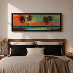 A panoramic tropical beach painting showing tall palm trees silhouetted against a vivid sunset sky with warm red, orange, and turquoise tones, overlooking a calm ocean horizon and sandy shoreline, creating a vibrant coastal landscape stretching across the wide horizontal composition.