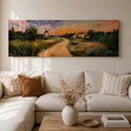 A panoramic countryside landscape painting showing a winding dirt road leading through grassy fields toward a traditional windmill and small farmhouse under a glowing sunset sky, with soft clouds and warm golden light illuminating the rural scenery across the wide composition.