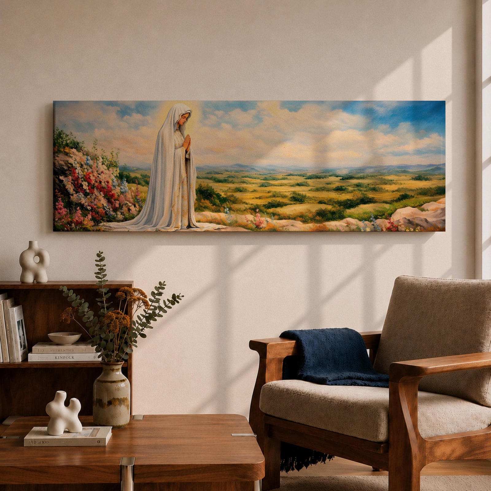 Panoramic painting of the Virgin Mary, the Blessed Mother, standing in prayer on a hillside with colorful flowers overlooking a peaceful countryside landscape beneath a soft blue sky.