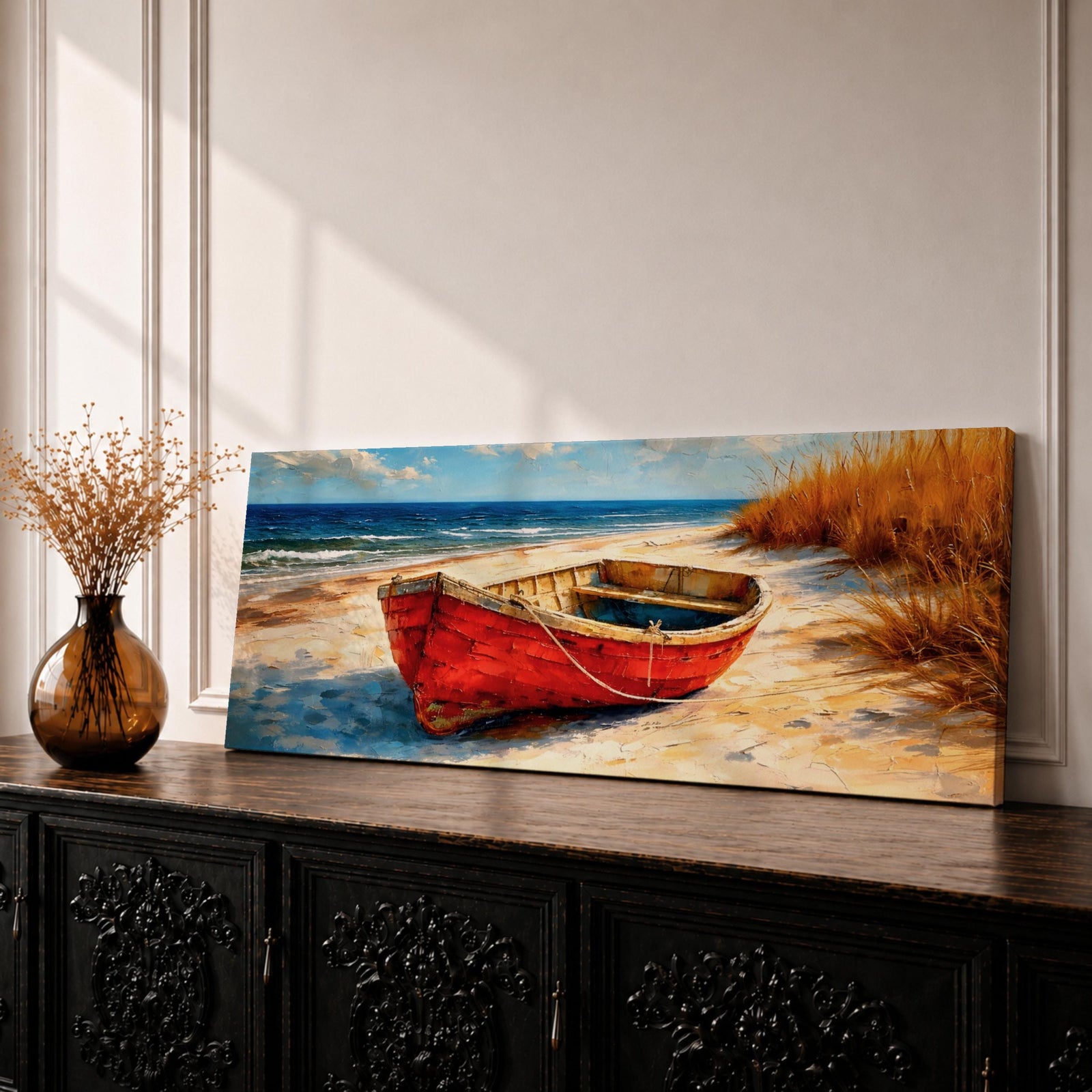Panoramic coastal painting of a weathered red wooden boat resting on a sandy beach beside tall golden dune grass with the blue ocean and gentle waves in the background.