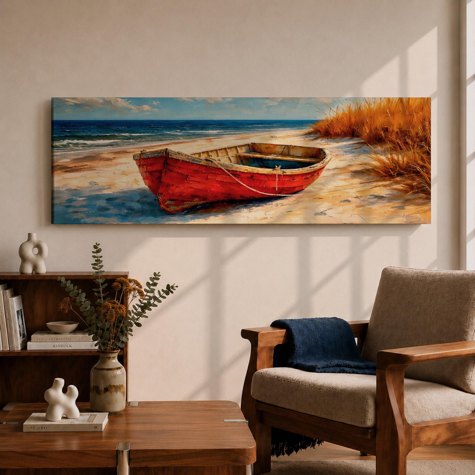 Panoramic coastal painting of a weathered red wooden boat resting on a sandy beach beside tall golden dune grass with the blue ocean and gentle waves in the background.