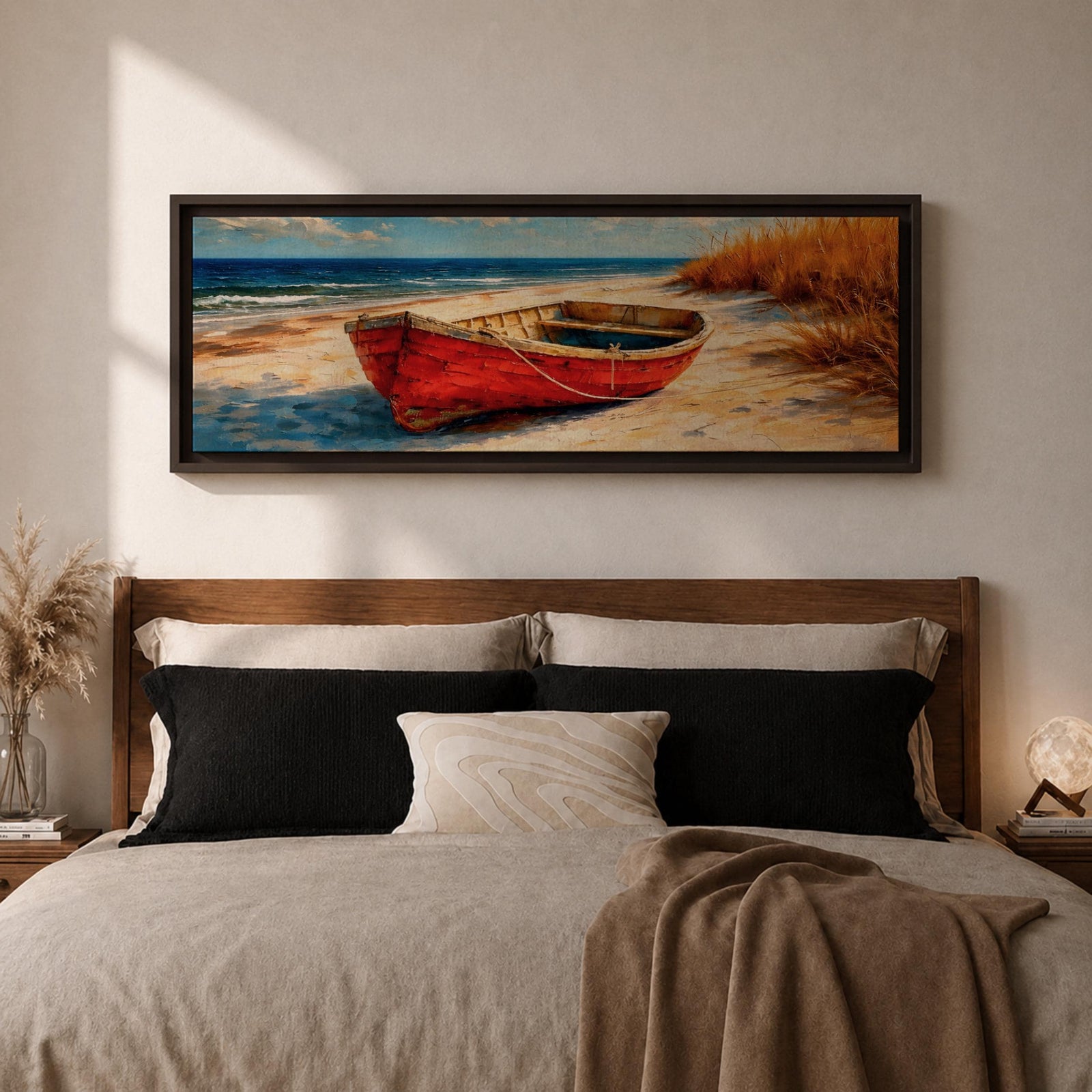 Panoramic coastal painting of a weathered red wooden boat resting on a sandy beach beside tall golden dune grass with the blue ocean and gentle waves in the background.