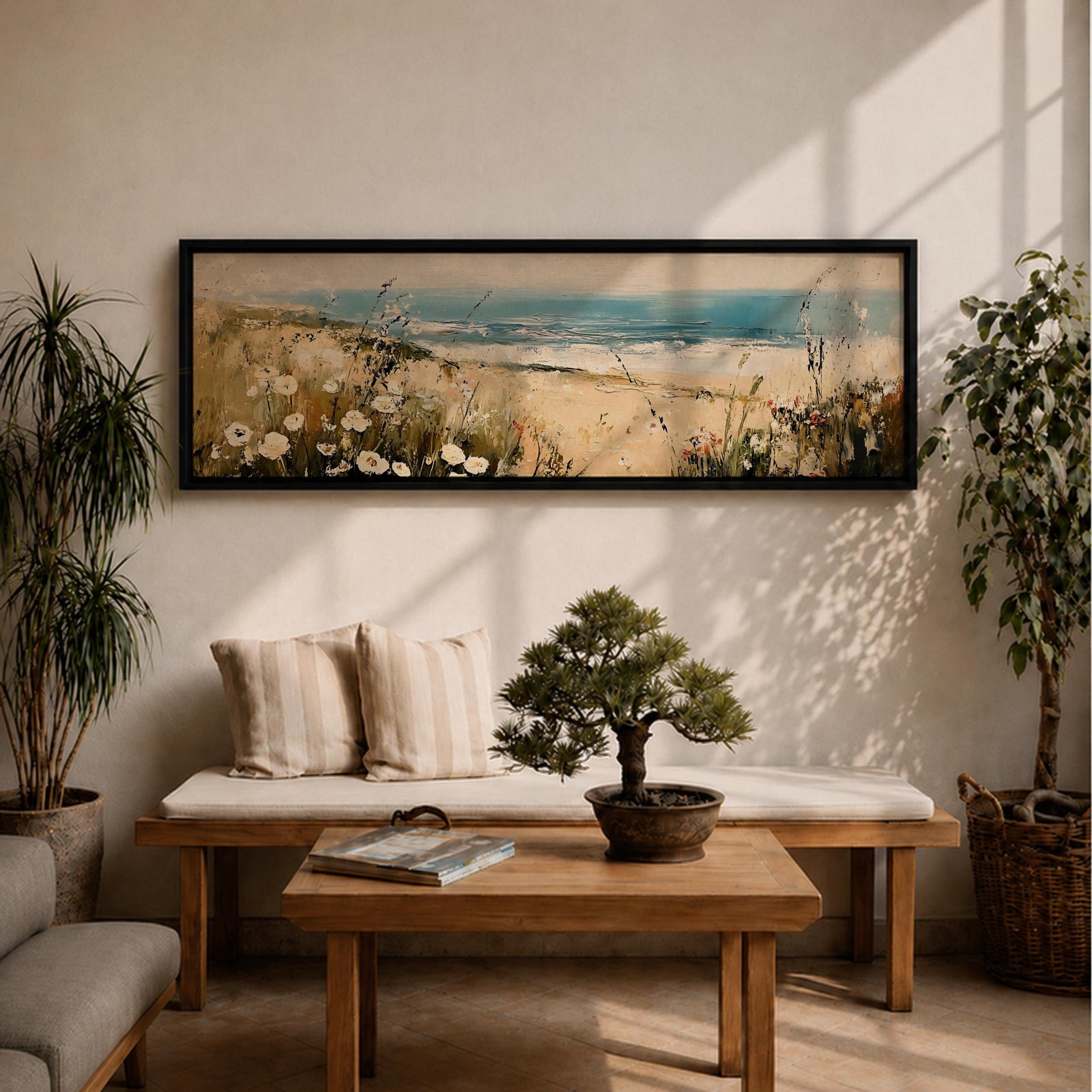 A long panoramic coastal painting showing sandy dunes covered with wild grasses and small white flowers overlooking a calm ocean shoreline. Soft waves roll toward the beach beneath a pale blue sky while textured brush strokes create a peaceful seascape landscape stretching across a wide horizontal composition.