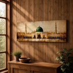 A long panoramic painting of the Prophet’s Mosque in Medina featuring the iconic green dome centered above grand archways and courtyards. Tall minarets rise on both sides while warm golden tones and textured brush strokes depict the historic Islamic mosque complex in a wide horizontal architectural composition.